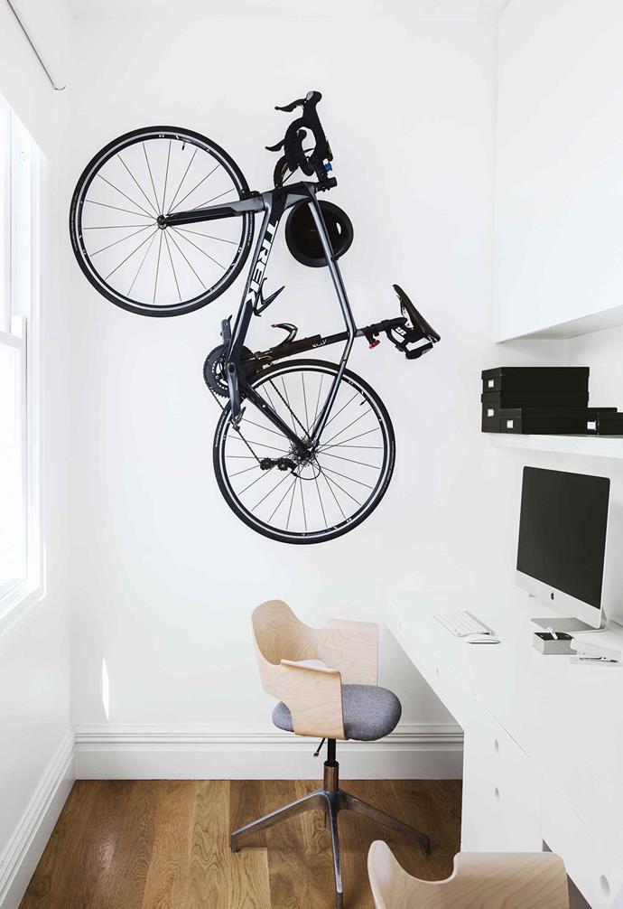**MULTIFUNCTIONAL**
<br> 
Despite the narrow width of this home office room, the residents of this [minimalist light-filled terrace](https://www.homestolove.com.au/minimalist-inspiration-from-a-light-filled-terrace-18366|target="_Blank") added a wall hook for bike storage. "This could have been another bedroom, but we wanted a workspace for both of us," say the homeowners.
<br>
*Photography: Chris Warnes | Styling: Natalie Walton*