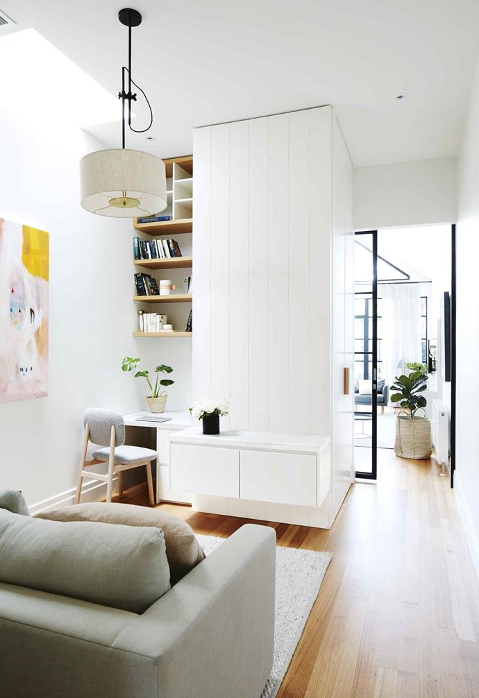 **GO VERTICAL**
<br>
If going wide isn't an option, think about going up instead like in [this Scandinavian-style Melbourne home](https://www.homestolove.com.au/scandinavian-style-makeover-in-the-heart-of-melbourne-17515|target="_blank"). In this narrow living room study nook, ample shelving is installed almost all the way to the ceiling, keeping the desk surface clear. The cosy lounge behind the nook completes the home office area, allowing an option for more comfortable working. 
<br>
*Photography: Armelle Habib | Styling: Heather Nette King*