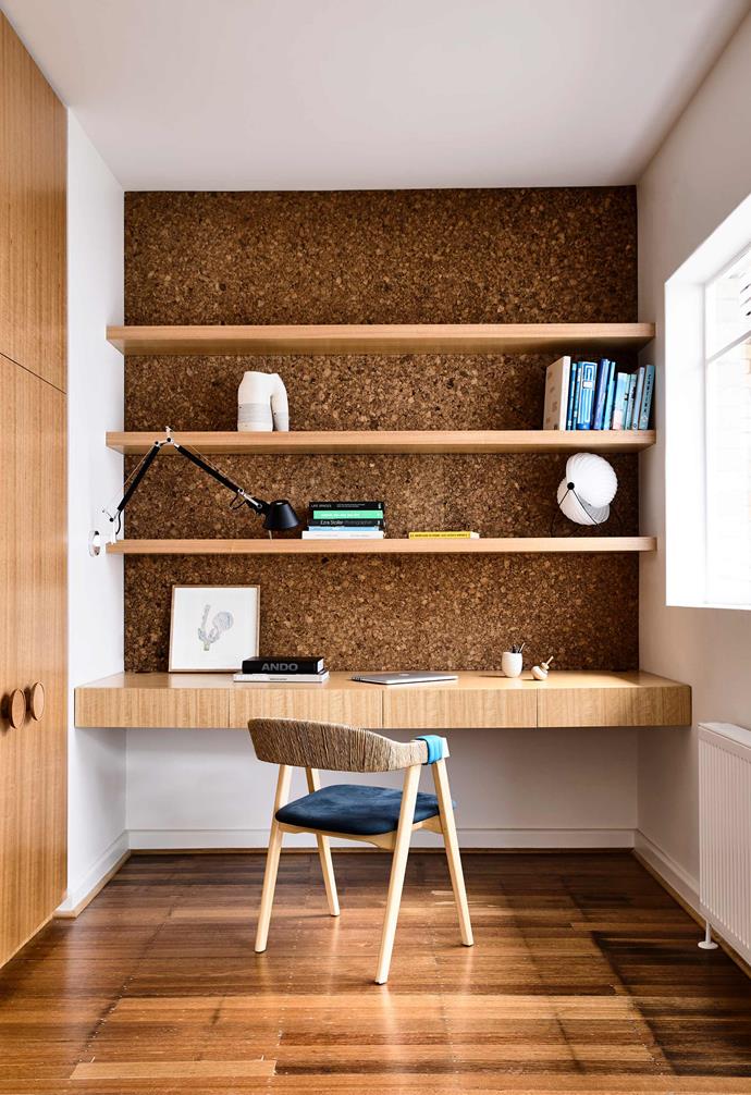 **HIDDEN STORAGE** 
<br>
The thickness of the desk in this [modernist red brick home](https://www.homestolove.com.au/modernist-red-brick-home-17821|target="_blank"|rel="nofollow") conceals drawers and tall cabinetry to the side allows for extra household storage. The cork [feature wall](https://www.homestolove.com.au/feature-wall-ideas-5308|target="_blank") adds dynamic depth to this home office, and also allows for the pinning of notes and papers when needed. 
<br>
*Photography: Derek Swalwell*
