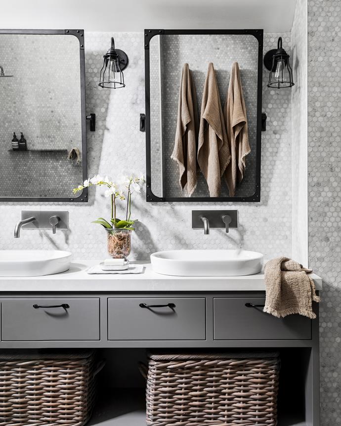 Signorino tiles complement the vanity top made by a local craftsman. Lights and tilt mirrors, Restoration Hardware (US). Baskets, Pottery Barn.