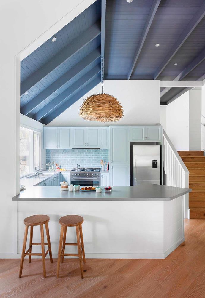 **Connectivity** Rather than featuring a floating island, this kitchen's island bench acts as a boundary line to separate the kitchen from the rest of the home. The angled edge visually softens the impact. *Photography: Martina Gemmola / bauersyndication.com.au*