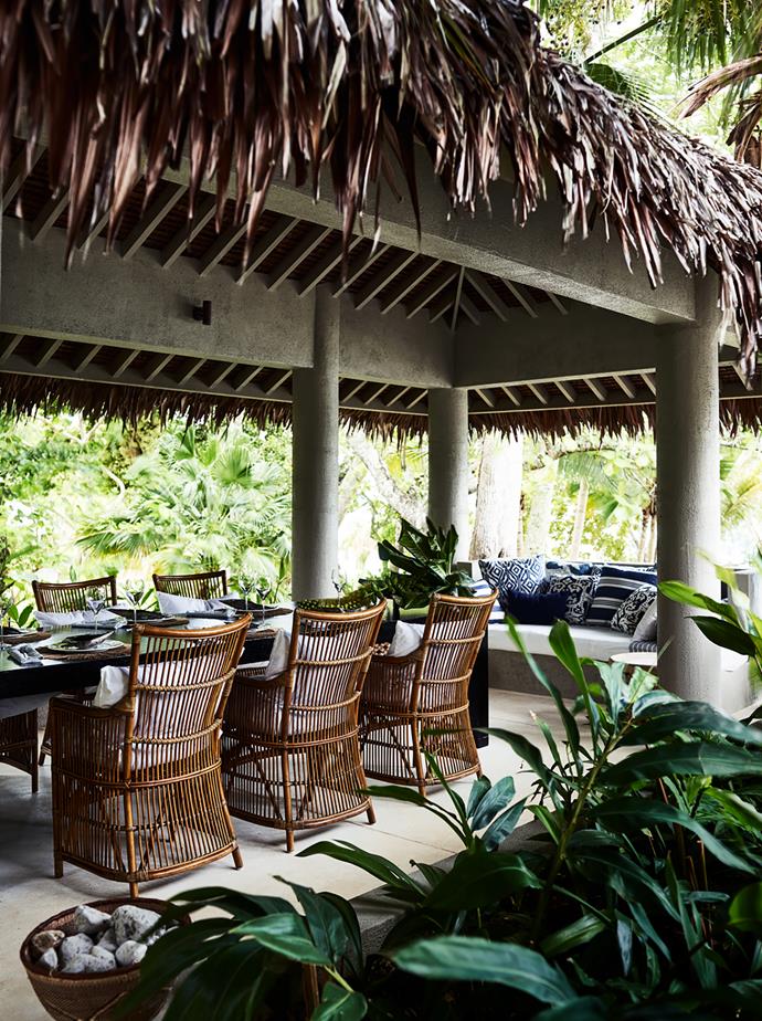 Adjoining the main house of this Vanuatu home designed by BKH and Bramley Constructions is an outdoor dining space with a natangura palm roof installed by locals. *Photograph*: Anson Smart. From *Belle* April 2017.