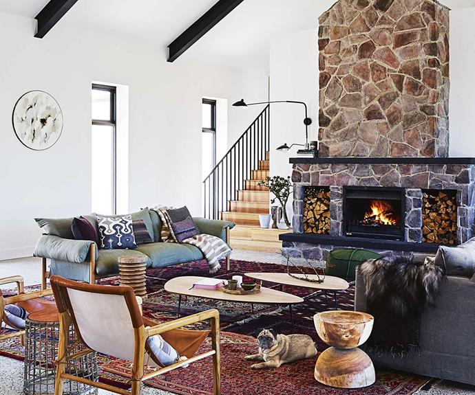 Modern country style farmhouse living room with stone fireplace