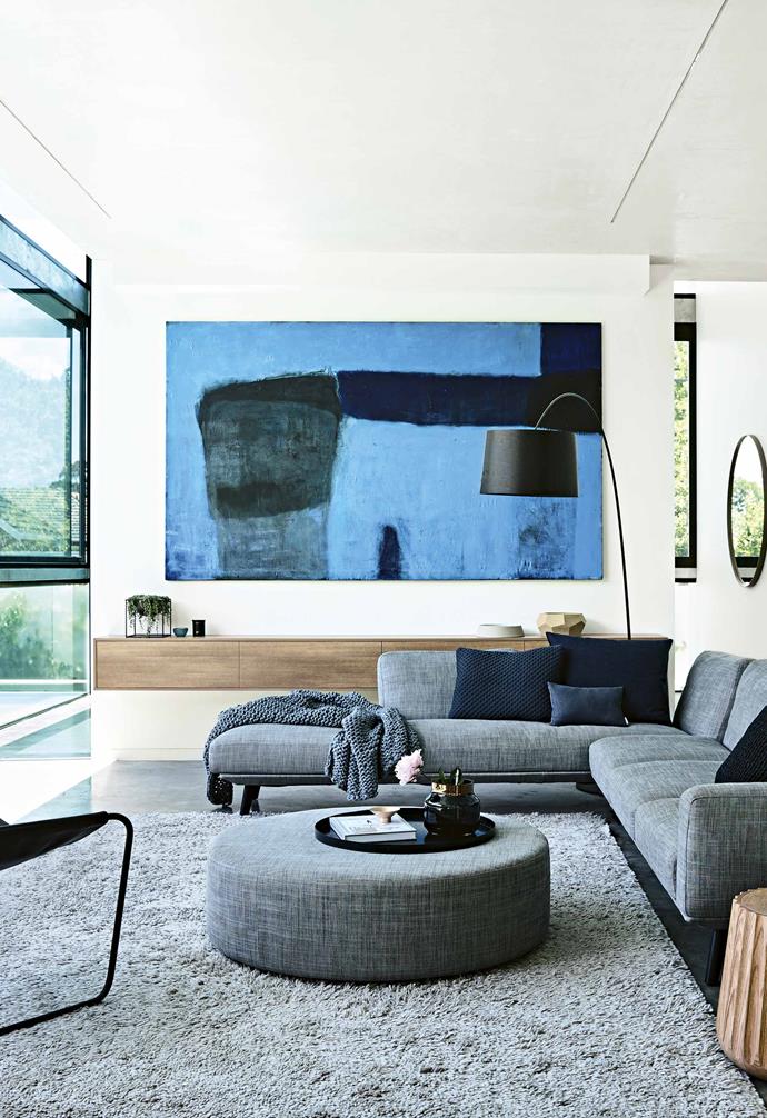 "As a consequence, we have the downstairs basement, which is like a teenager's retreat with a billiard table, TV and sofa where the teenagers can hang out," says Steph. The underground view of [the pool](https://www.homestolove.com.au/pool-design-trends-australia-19600|target="_blank") is a striking source of light. Above ground, the living, kitchen and outdoor spaces are beautifully blended. "There are distinctive areas in the house where you can retreat to, but everything is still quite connected," says interior designer Mikayla.<br><br>**Living area** The top of the glass between the living space and pool slides away – [no need for a pool fence](https://www.homestolove.com.au/how-to-design-a-good-looking-pool-fence-that-blends-into-your-yard-10350|target="_blank")! "It's terrific when the kids are in the pool and we're inside," says Steph. [The TV also does a disappearing act](https://www.homestolove.com.au/ways-to-camouflage-your-tv-2967|target="_blank"), retracting into the ceiling when not in use. "The TV drops down at the push of a button." 'Emi Pod' Stools, [Anaca Studio](https://www.anacastudio.com.au/|target="_blank"|rel="nofollow") Foscarini 'Twiggy' floor lamp, [Space Furniture](http://www.spacefurniture.com.au/|target="_blank"|rel="nofollow"). Inax 'Repeat Wave' tiles, $154/sqm, [Artedomus](https://www.artedomus.com/|target="_blank"|rel="nofollow"). Painting by [Andrew O'Brien](http://www.andrewobrienartist.com/|target="_blank"|rel="nofollow").