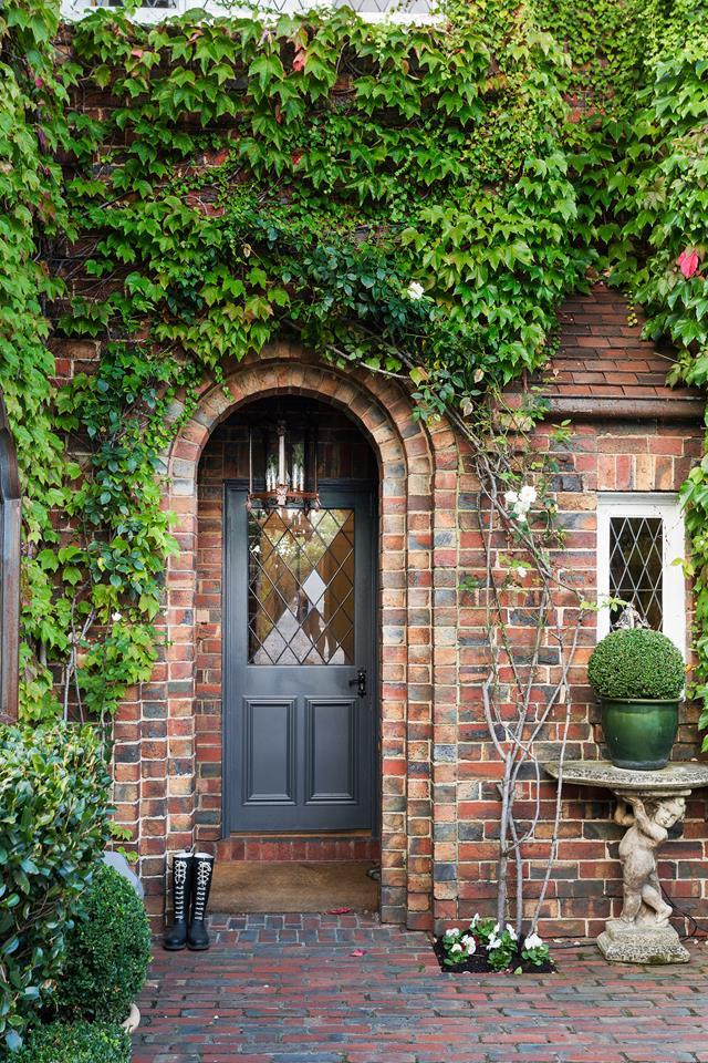 Ivy and climbing roses, underplanted with pansies, play up the old-world charm of Chyka Keebaugh's [manor-style home](https://www.homestolove.com.au/the-home-of-real-housewives-star-chyka-keebaugh-5549|target="_blank").