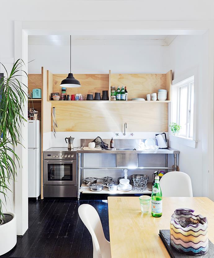 This low-budget kitchen reno is packed with loads of character. The light plywood storage creates a laidback vibe and the no-fuss commercial stainless steel sink is a practical addition. With all that open shelving, painting your walls white will minimise visual clutter. 

*Photographer: Felix Forest*