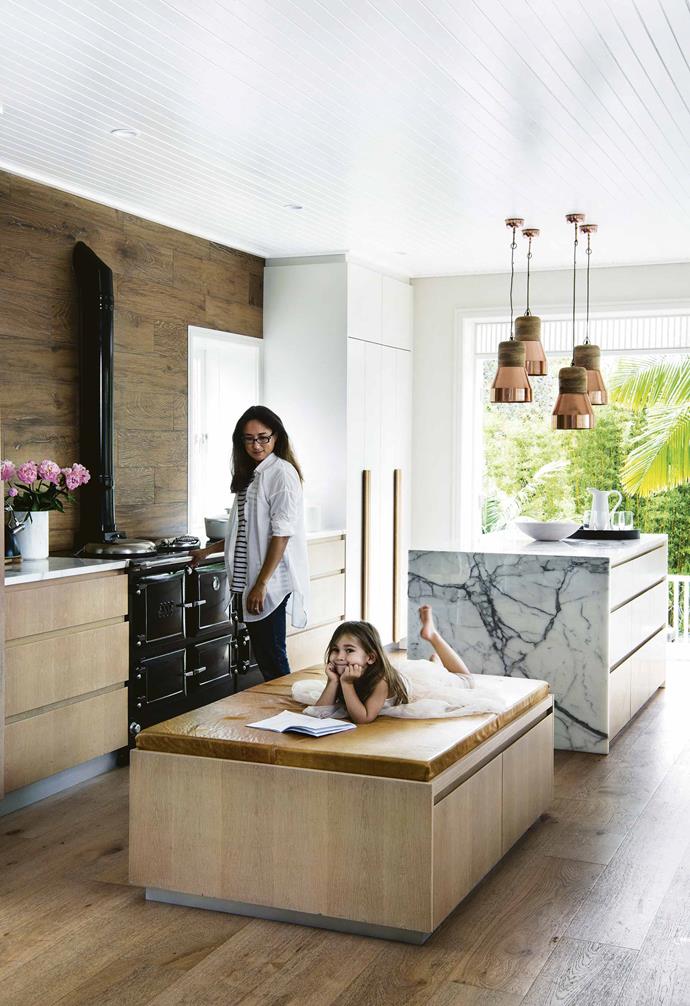 White calacatta marble forms the [kitchen island](https://www.homestolove.com.au/kitchen-inspiration-13-of-the-best-island-benches-17943|target="_blank") overlooking the garden "where I can keep an eye on the kids in the pool," says Tash. Next to it, a giant ottoman – upholstered in 1803 deer hide from Orange – is where the kids do their homework after school.<br><br>**Kitchen** The Esse wood-fired stove keeps the house warm in winter by powering the radiators. Copper pendant lights provide focused [task lighting](https://www.homestolove.com.au/task-lighting-how-to-light-a-room-with-lamps-2341|target="_blank") over the calacatta marble island bench. Limed oak-veneer cabinetry by [Homestyle Kitchens](http://homestylekitchens.com.au/|target="_blank"|rel="nofollow") provides plenty of built-in storage space. Le Creuset Dutch oven and Marble canister, [Williams-Sonoma](http://www.williams-sonoma.com.au/|target="_blank"|rel="nofollow").