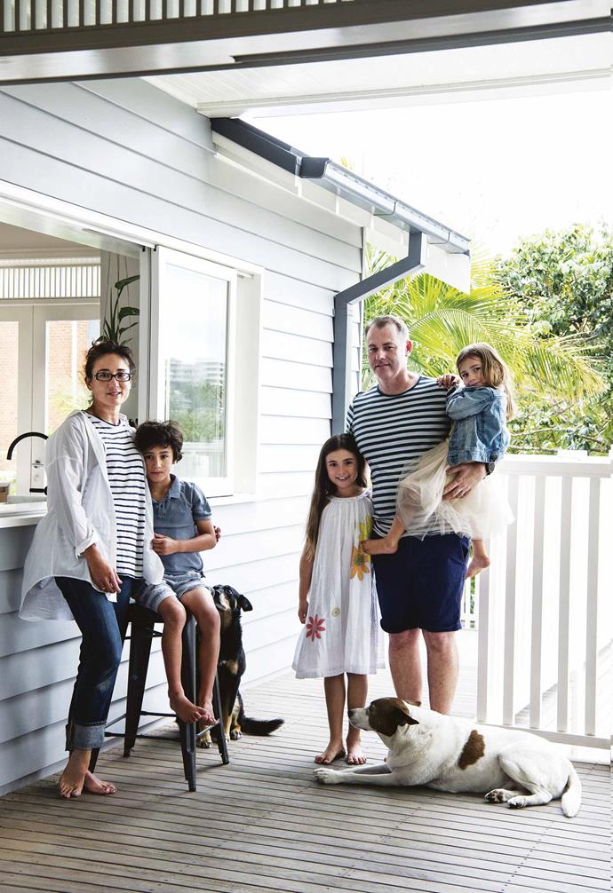 The house had to accommodate their clan – three children, two dogs, one cat and nine chickens – and the five tiny bedrooms had now spawned five spacious ones; the dark [living room](https://www.homestolove.com.au/20-best-open-plan-living-designs-17877|target="_blank") became light and airy, and the kitchen (both Tash and Tony are passionate cooks) had been transformed into the heart and soul of the home.<br><br>**Portrait** Tash and Tony relax on the deck with their children Maddox, Harriet, and Ginger. Beloved pups Maggie and Jack keep the family company.