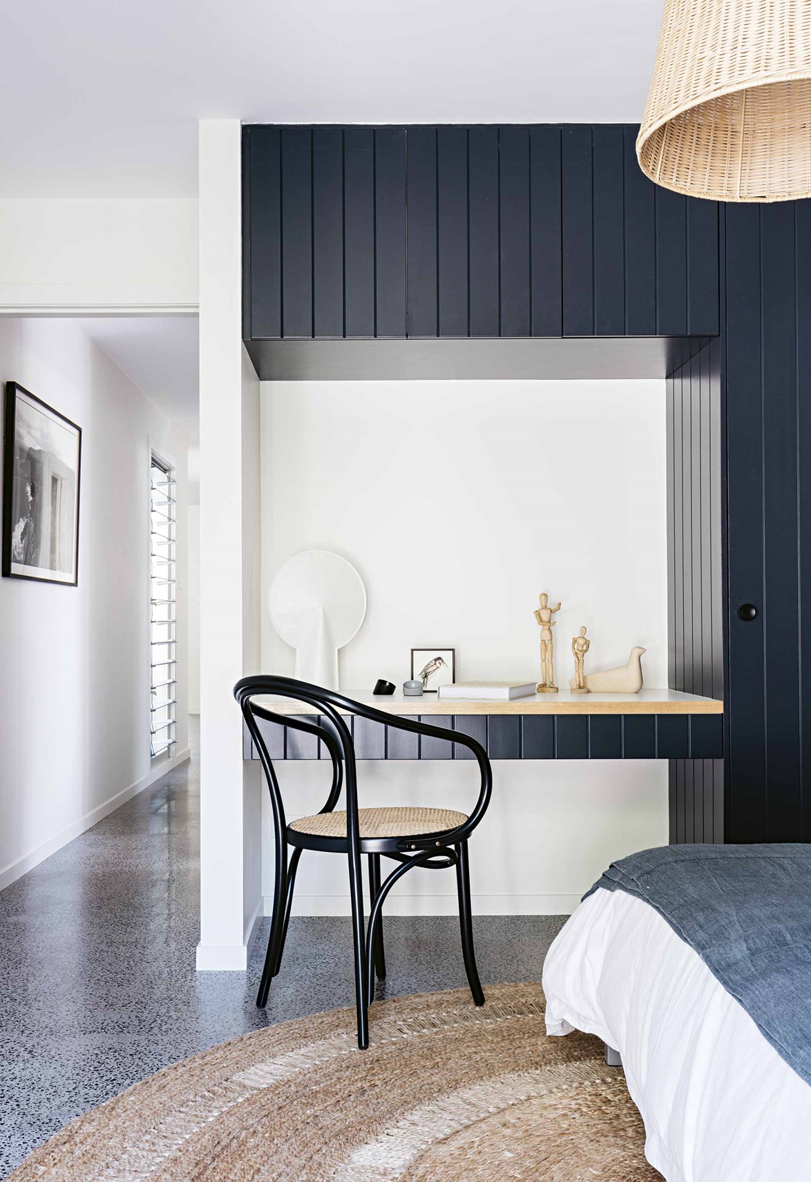 <p>**TO TRANSFORM A WARDROBE INTO A WONDERFUL FEATURE**<p>
<p>A panelled wardrobe becomes a feature wall in its own right in this [coastal home on McMaster's Beach](https://www.homestolove.com.au/macmasters-beach-house-18226|target="_blank"). Here, part of the wardrobe has been carved out as a study nook. Workinng alongside [Arent & Pyke](https://www.homestolove.com.au/colourful-california-bungalow-by-arent-and-pyke-4946|target="_blank") , the owners chose to adopt timber cladding throughout the home in reference to the other 1950s weatherboard homes in the neighbourhood.<p>
<P>*Photo: Felix Forest / Story: Inside Out*<P>