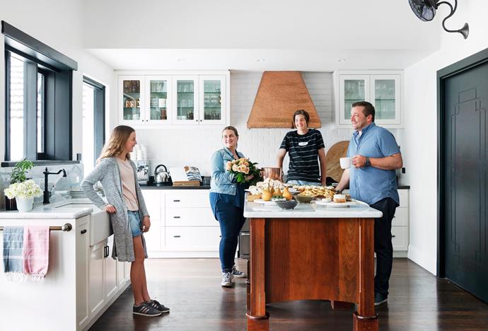 Debra and Tristan join children Stella and Connor. A good example of the home's old-meets-new aesthetic is the modern extractor, fitted inside the existing copper rangehood. Carrara marble benchtops.