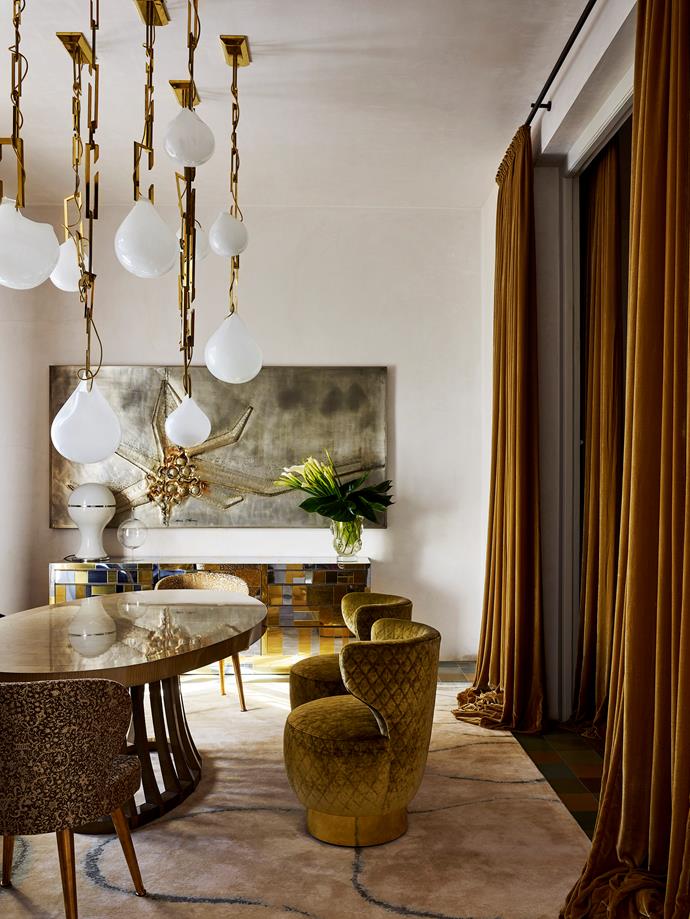 This opulent Melbourne home designed by Christian Lyon wholeheartedly embraces the curved furniture trend. The dining room boasts a Christian Lyon for Matsuoka 'Opera' table and custom-designed swivel chairs in quilted velvet with a brass base. *Photograph*: Anson Smart. From *Belle* February/March 2019.