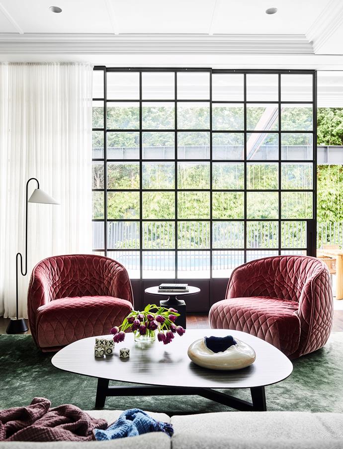 Alexandra Donohoe Church of Decus Interiors has imbued this home with glamour, incorporating a ClassiCon 'Roattino' floor light by Eileen Gray from Anibou, Moroso 'Redono' armchairs in pink velvet and Morso 'Phoenix' coffee table all by Patricia Uriqiola from Hub. *Photograph*: Anson Smart. From *Belle* August/September 2018.