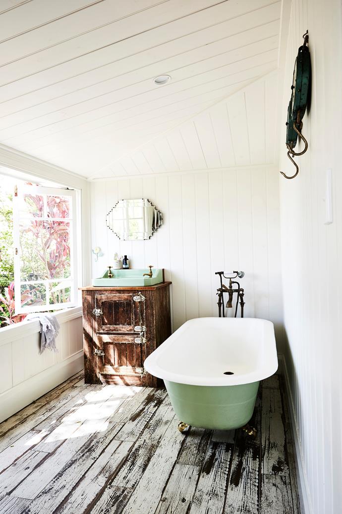 The vanity in the ensuite was a meat safe that the couple converted, and the vintage clawfoot bathtub was restored by Scott.
