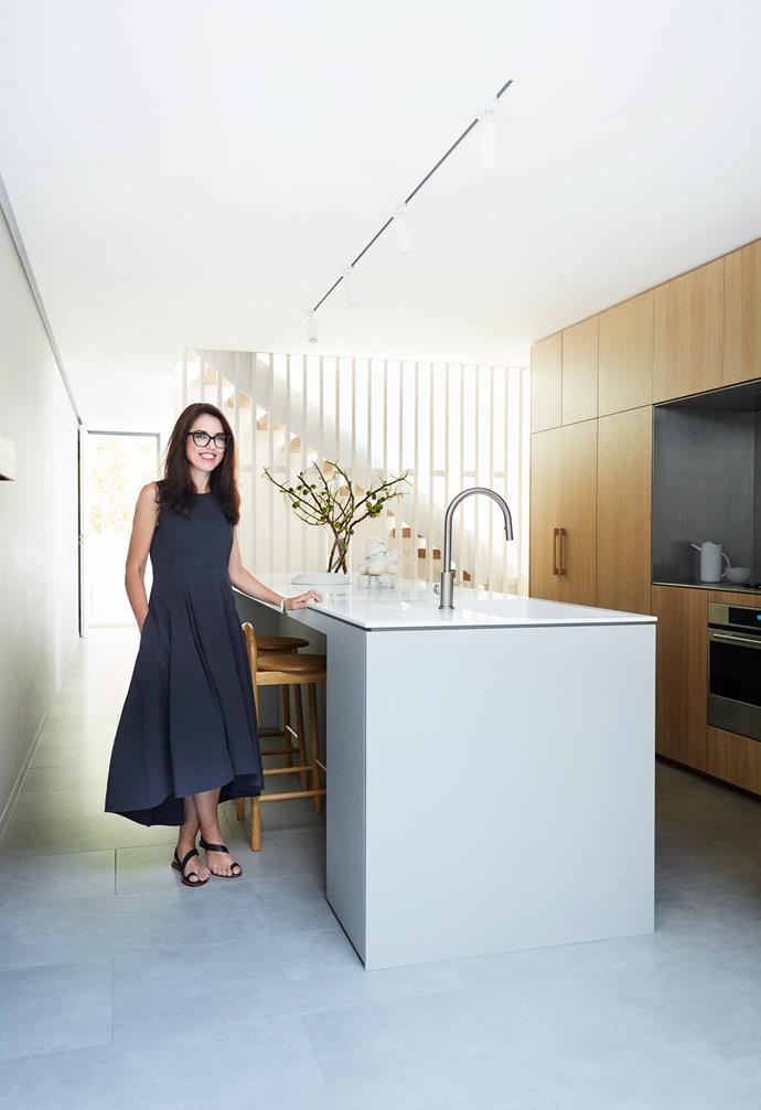 **Alison Nobbs | Principal architect, [Nobbs Radford Architects](https://www.nobbsradford.com.au/|target="_blank"|rel="nofollow")**<br><br>A different approach was required for the inner-Sydney kitchen of Alison Nobbs, a space that's connected to the living and dining area yet defined as completely separate. "Living in the inner city, my house is compact," says Alison. "It was important to establish different zones, so that conflicting activities could happen concurrently and separately." <br><br>While an open-plan concept was off the table, a visual connection still had to be considered. "The main timber wall is double-sided and wraps around to the dining room – I wanted it to look more like a piece of furniture than kitchen cupboards," says the architect, who selected resilient yet good-looking materials throughout. <br><br>*Visit [Nobbs Radford Architects](https://www.nobbsradford.com.au/|target="_blank"|rel="nofollow") | Styling: Natalie Johnson | Photography: Prue Ruscoe | Artwork: Knockerdli sculpture by Carol Crawford, [Becker Minty](https://www.beckerminty.com/|target="_blank"|rel="nofollow")*.