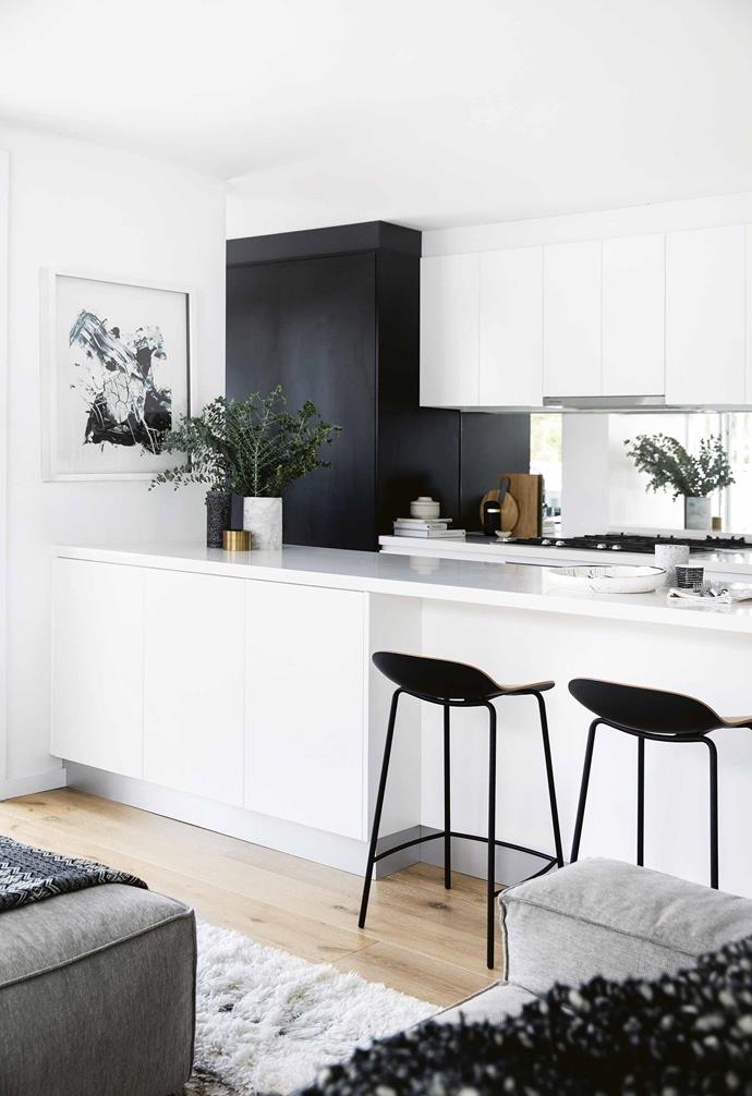 The ground-floor plan also works to fill the house with light, a top priority, while delivering two living zones within an [open-plan space](https://www.homestolove.com.au/20-best-open-plan-living-designs-17877|target="_blank"). "I think it's really important to have more than one living area in a family home," says Sophie.<br><br>**Kitchen** The kitchen was treated to quality appliances from [Miele](https://shop.miele.com.au|target="_blank"|rel="nofollow") and [Fisher & Paykel](https://www.fisherpaykel.com/|target="_blank"|rel="nofollow") to cater to Dean and Sophie's love of cooking. Streamlined joinery by Forstar Kitchens is paired with a mirrored splashback, while [Città](https://www.cittadesign.com/|target="_blank"|rel="nofollow") stools create an eat-in dining zone. Zakkia vase, jar and vessel, [The Minimalist](https://www.theminimalist.com.au/|target="_blank"|rel="nofollow"). 'Carlo' vase, [Clickon Furniture](https://www.clickonfurniture.com.au/|target="_blank"|rel="nofollow"). Bowl and salad servers, [Dinosaur Designs](https://www.dinosaurdesigns.com.au/|target="_blank"|rel="nofollow").