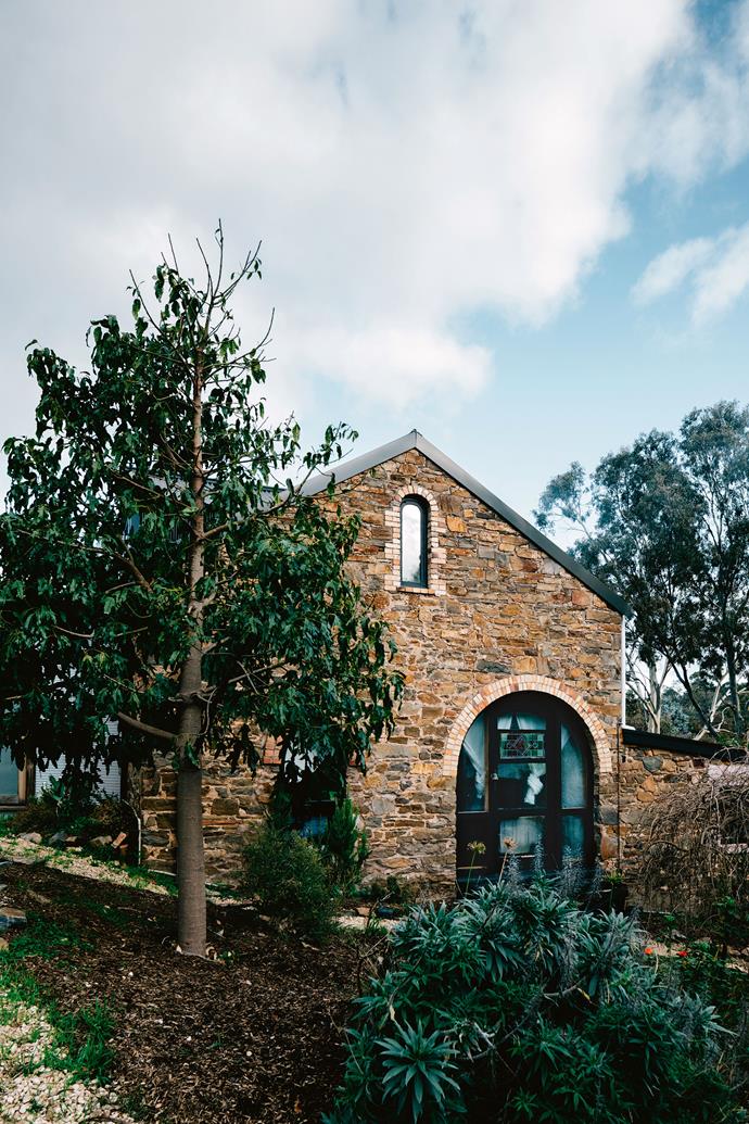 This grand, solid stone build, constructed in 1870s, was once a bacon factory, namely [Factoria V11](https://www.homestolove.com.au/factory-home-conversion-13873|target="_blank"). Today, it is the home of Alia Elaraj and photographer Scout Edwards, providing them with a daily dose of serenity and country living. "We just fell in love with the house, it was so exceptional," Alia says. "Nothing else that we had seen ticked the boxes, and it was in our price range, close to Oliver's school, and was on half an acre, just enough for what we wanted."