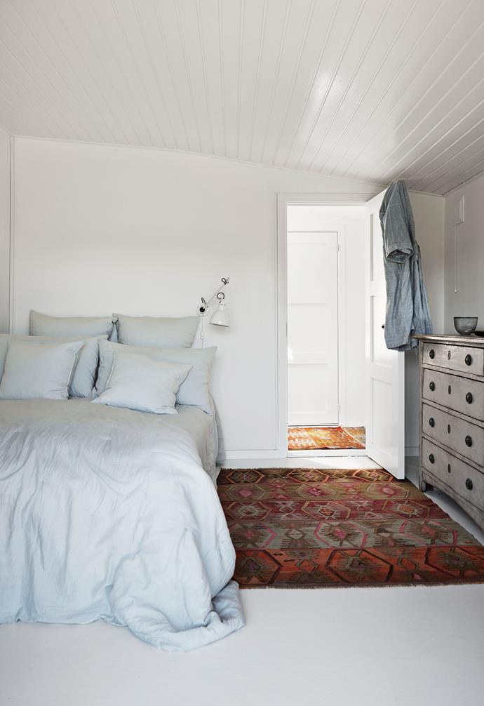 The master bedroom features light blue bed linen. "One of the best things we've done to the place is open it up and create more fluid transitions between the various functions of the house," says Jette. "I've also tried to get as much light into the house as possible, which is something I aim for in every project I undertake."