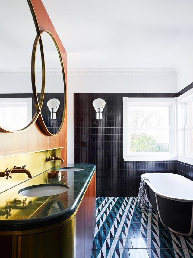 The brief for this apartment was a [Latin-inspired rejuvenation](https://www.homestolove.com.au/makeover-of-an-art-deco-apartment-in-bondi-6291|target="_blank") of the original art deco features with bold, geometric ceramics, warm timbers, raw brass detailing and custom terrazzo. 'Backgammon' bathroom floor tiles by Gio Ponti with Inax 'Yuki Border' wall tiles from Artedomus. Designheure 'Baby Cargo' wall lights. *Photograph*: Anson Smart | *Belle*