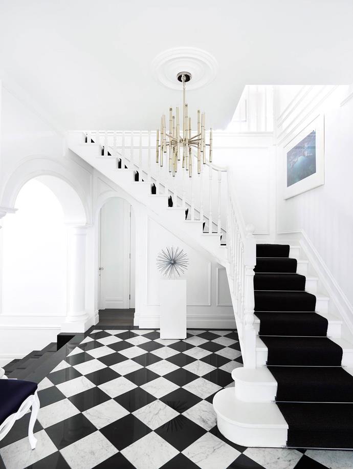 The imposing entry sets the scene for the whole house. The [Greg Natale interiors](https://www.homestolove.com.au/gallery-emma-and-tonis-luxurious-regency-style-home-2311|target="_blank") are a blend of different styles, but Hollywood Regency is the predominant one. *Photograph*: Anson Smart | *Belle*