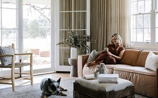 Edwina Bartholomew in the living room of her holiday home in the Blue Mountains