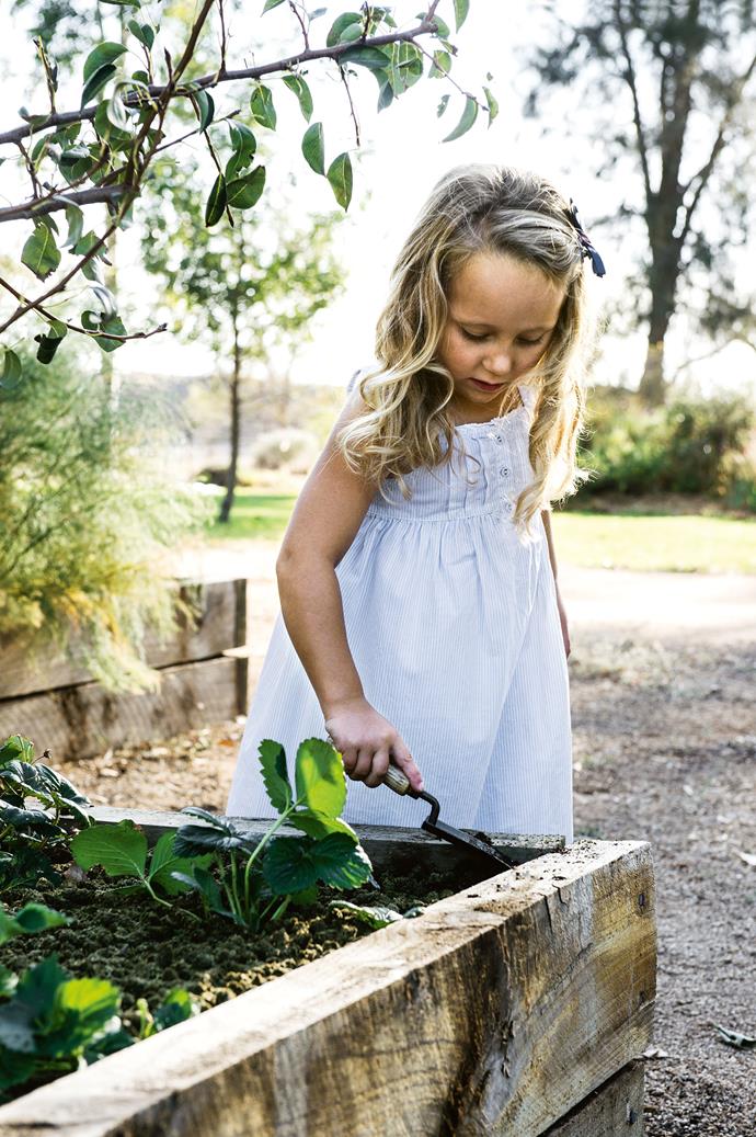 Five-year-old Catherine enjoys a spot of gardening.