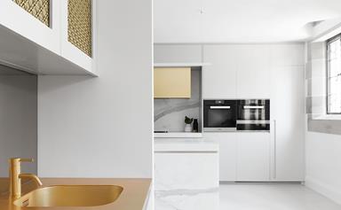 A modern kitchen with gold and grey accents