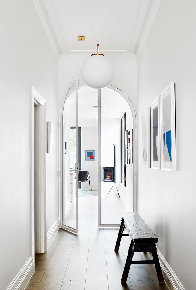 Kathryn Robson and Chris Rak's Melbourne home is an exercise in restraint and pure good taste. Artworks by Chris Connell in the hallway, which looks through to a Caspar Fairhall painting.