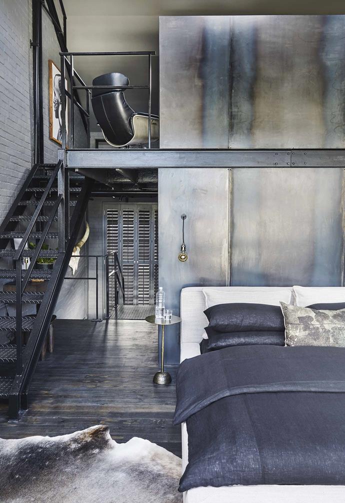 **Bedroom and mezzanine** The side tables and lamps were sourced from [Weylandts](https://www.weylandts.co.za/|target="_blank"|rel="nofollow"). A metal wall separating the bedroom and bathroom speaks to the industrial decor, while woven baskets add natural texture.