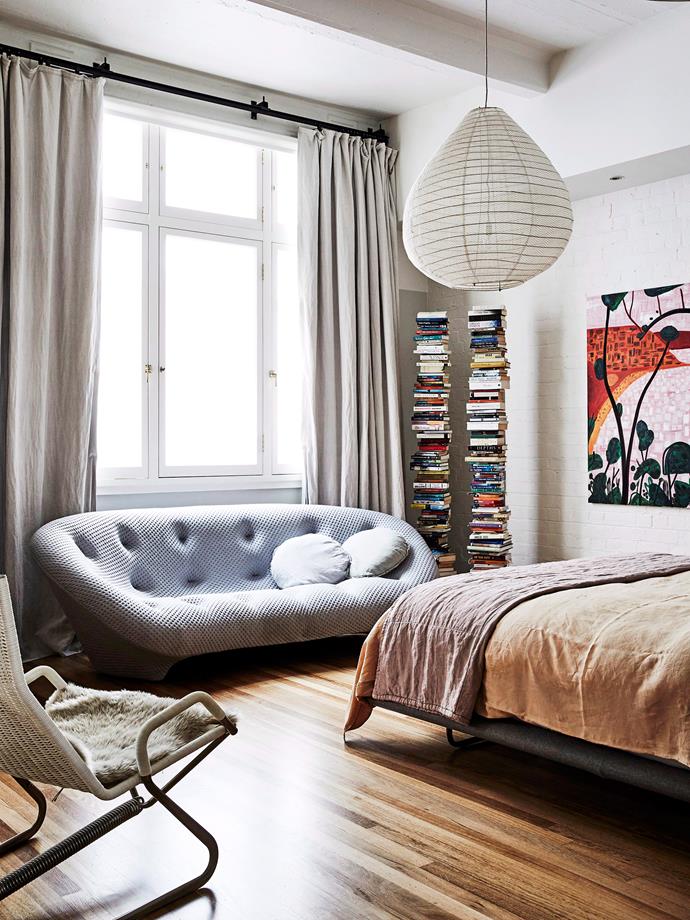 A muted palette and a curved 'Ploum Settee' by Ligne Roset (available through [Domo](https://www.domo.com.au/product/ploum/|target="_blank"|rel="nofollow")) keeps this bedroom feeling soft and cosy yet sophisticated. *Photo:* James Geer / *bauersyndication.com.au*