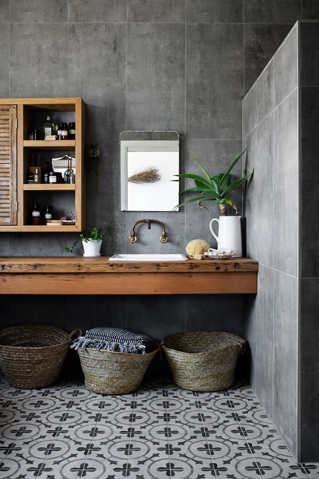 Patterned floor tiles and timber in the wall cabinet and oregon vanity in the bathroom of [this modern barn-style home](https://www.homestolove.com.au/modern-barn-style-house-19961#|target="_blank") create a sense of intimacy, despite the generous ceiling height.