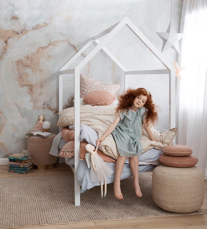 **The Princess and the Pea** 
<br><br>
A child's room needs to grow with them, which makes [removable wallpaper](https://www.homestolove.com.au/diy-removable-wallpaper-7041|target="_blank") an ideal decorating choice. Meanwhile, a whimsical canopy bed, gauzy curtains and plush poufs and pillows are what little girls' dreams are made of.