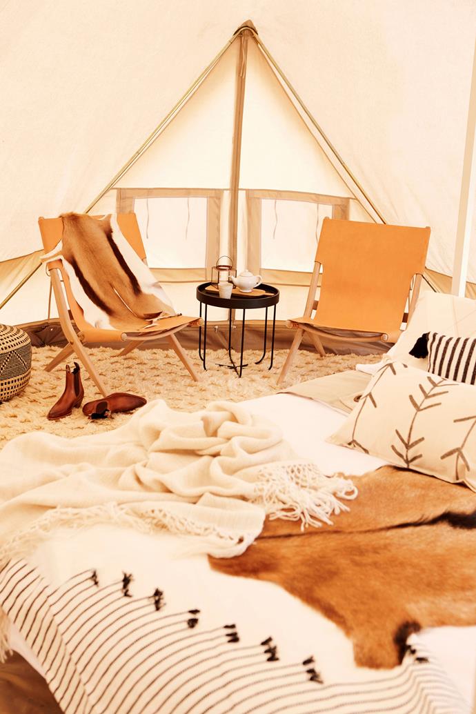 **Use luxe linens**

Skip blow up mattresses and sleeping bags on the ground and go for a camping bed piled high with soft cushioning and luxe linens. *Photo:* Max Doyle