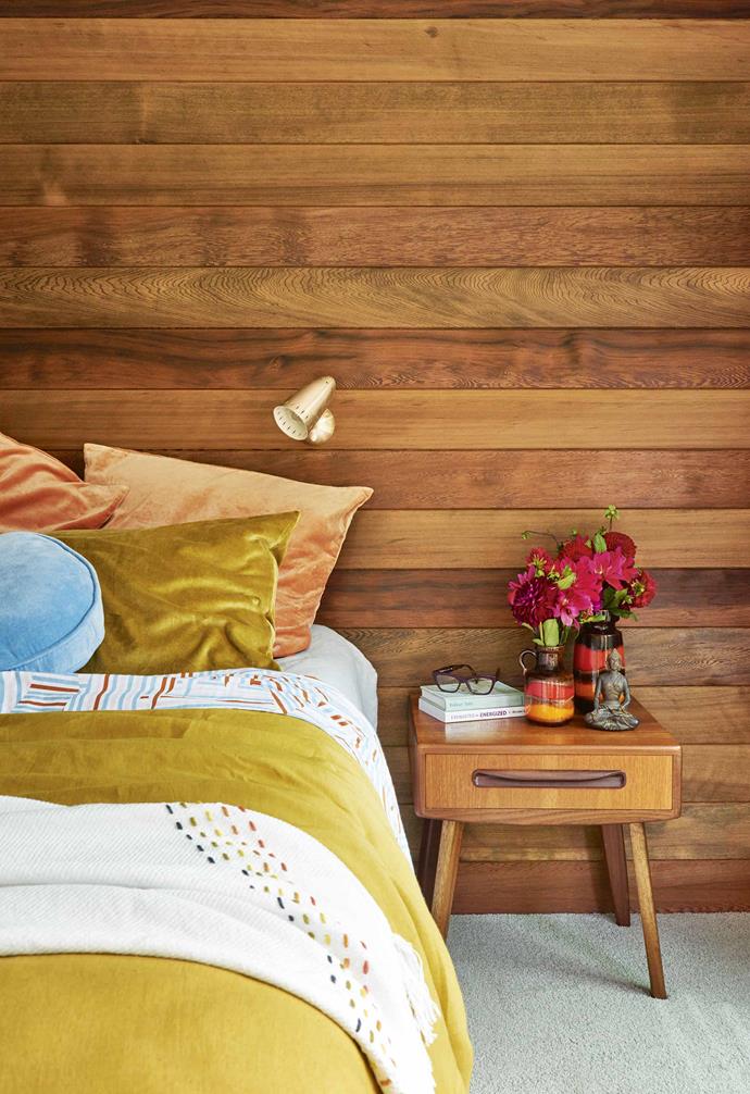 **Feature wall** A natural cedar panelled feature wall in this [retro coastal home in Torquay](https://www.homestolove.com.au/retro-coastal-home-torquay-18573|target="_Blank"|Rel="nofollow") continues the warm timber palette of the rest of the home, with the different grains and tones of the timber adding visual depth to the space. *Styling: Emma O'Meara | Photography: Nikole Ramsay*.