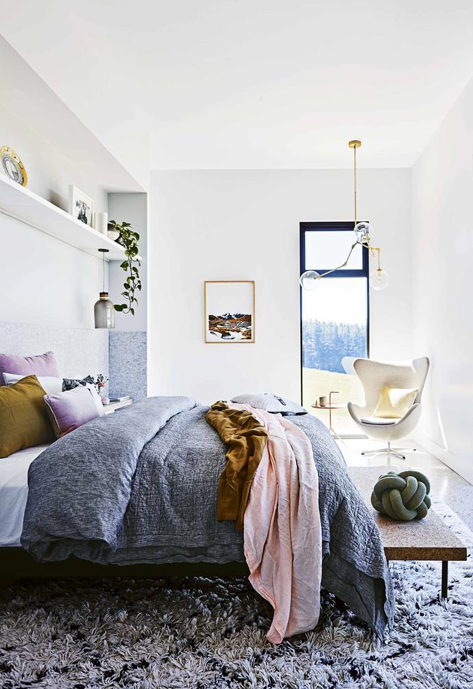 **Tactile finish** Acoustic panels from Bunnings behind the bed lend a cosy feel in this [modern country farmhouse](https://www.homestolove.com.au/step-inside-this-cosy-country-farmhouse-with-modern-interiors-17468|target="_blank"), and an in-built floating shelf above the bed adds additional storage to the bedroom. *Styling: Jono Fleming | Photography: Anson Smart*.