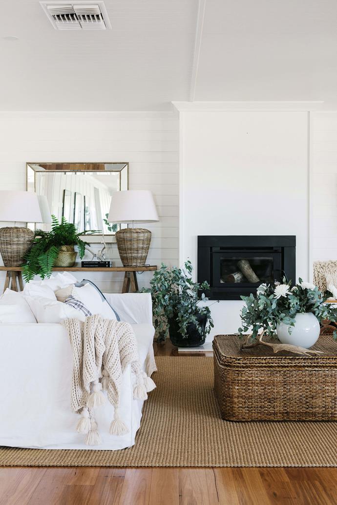 Linen sofas set the scene in the all-white living room of the home. Rebecca sourced a number of cane pieces, including the coffee table in the living room, the base of the lamp in the sitting room and a large chest at the end of the bed in the master bedroom from [Flamingo Road Homewares](https://flamingordhomewares.com.au/|target="_blank"|rel="nofollow").
