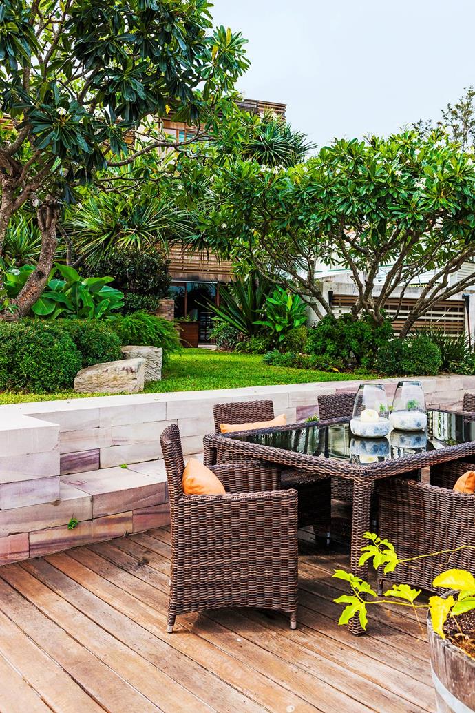 [Tropical-style landscaping](https://www.homestolove.com.au/eastern-aesthetic-inspires-new-build-in-brisbane-3805|target="_blank") around the house features lush plantings of gingers, frangipani, heliconias and pandanus.