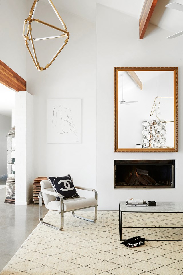 [Amanda Shadforth's mid-century-meets-Palms Springs style home](https://www.homestolove.com.au/oracle-fox-amanda-shadforth-home-20153|target="_blank") features a carefully considered mix of designer and vintage finds, like this '70s armchair that Amanda had reupholstered in velour. The rug is from Armadillo&Co.