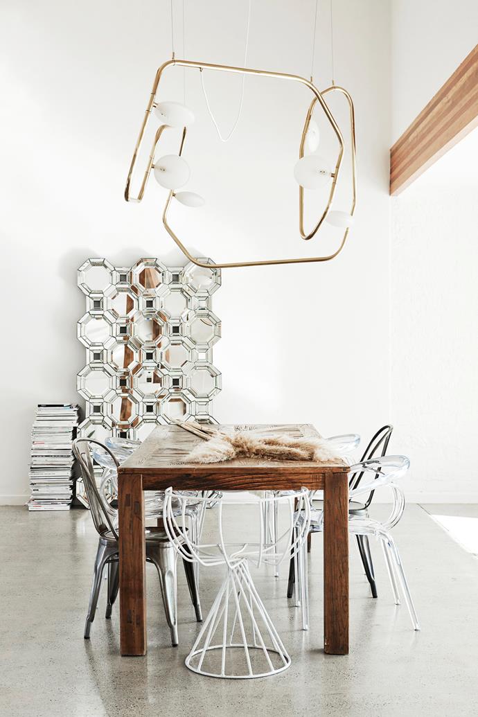 "I love this light from Amonson Lighting; it's like a line drawing dotted with sculptures," Amanda says. The dining chairs came from vintage stores, Gumtree and an art gallery she worked for prior to starting Oracle Fox.