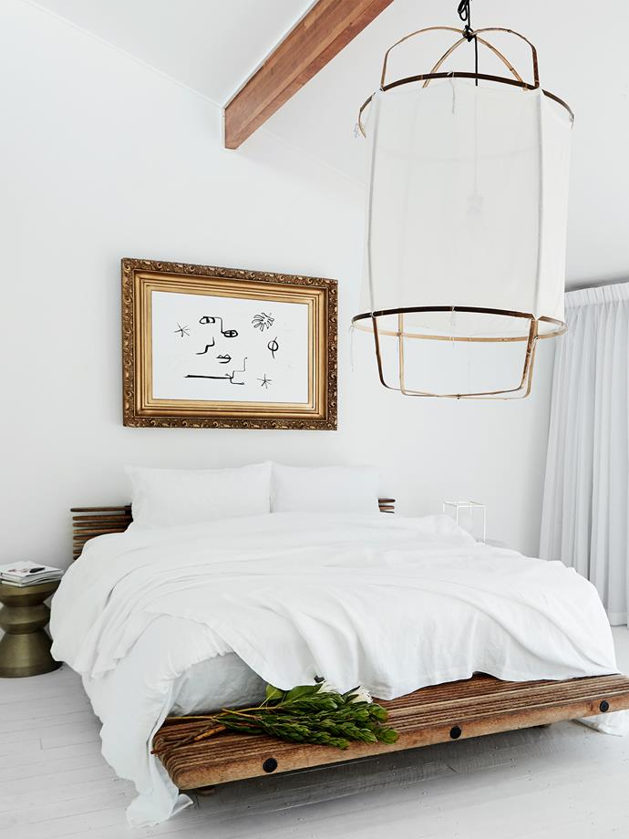 "Our bedroom is a good place to retreat to when we feel like some downtime," Amanda says. The bedframe is from Pacific Green, the throw is Cultiver and the light is by Ay Illuminate.