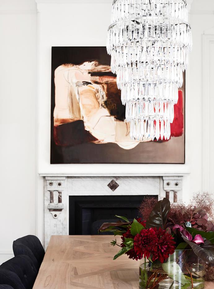 Waterford Crystal 'Etoile' chandelier from Cult hangs above the MCM House table. Chairs from Coco Republic. Artwork by Lisa Lacroix from Otomys.