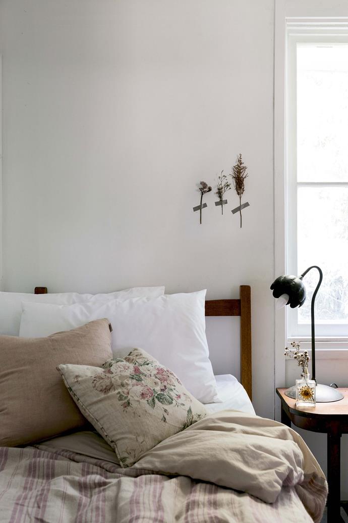 Lisa, who used to work as a visual merchandiser and props maker, describes herself as a forager. The spare bedroom features a quilt cover made from a French linen tablecloth. [Washi tape](https://www.homestolove.com.au/handy-woman-diy-wall-art-2968|target="_blank") has been used to form a display of dried flowers on the wall.