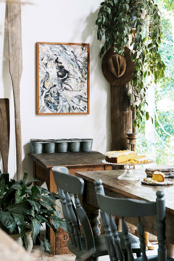 In the dining area, a painting titled Petrified Forest by Rosie Lloyd-Giblett provides a stunning focal point.