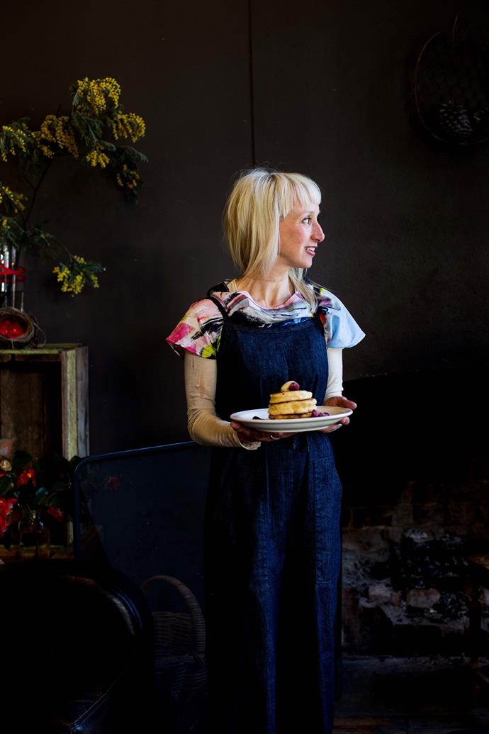 Laura Fraumeni, owner of Nest, with a plate of fluffy pancakes, served with local berries.