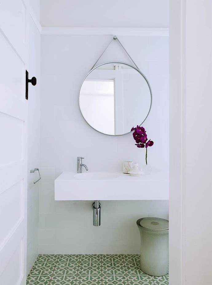 Athena encaustic tiles from Teranova add pattern and colour to this [otherwise sparse bathroom](https://www.homestolove.com.au/modernism-inspires-laid-back-family-home-2762|target="_blank"). Icon mixer from Astra Walker. Hay strap mirror from Cult.