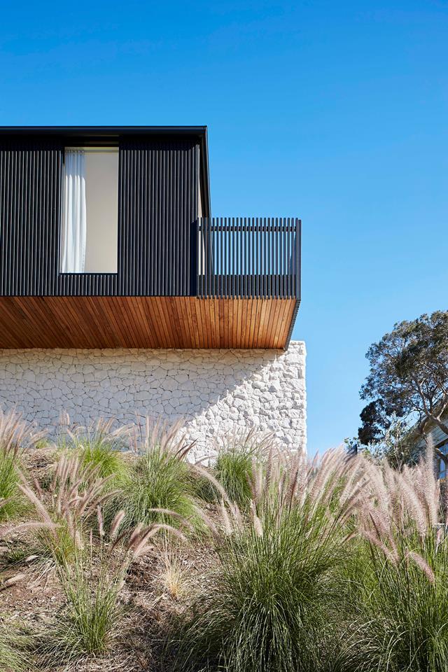 Featuring a 30-metre long glass facade that frames the sublime coastal views, and stone and timber cladding, it was important to interior designer Sally Caroline that the exterior of [this Sorrento-based home](https://www.homestolove.com.au/sorrento-beach-house-19328|target="_blank") felt like a beach house rather than a city house on a coastal block.