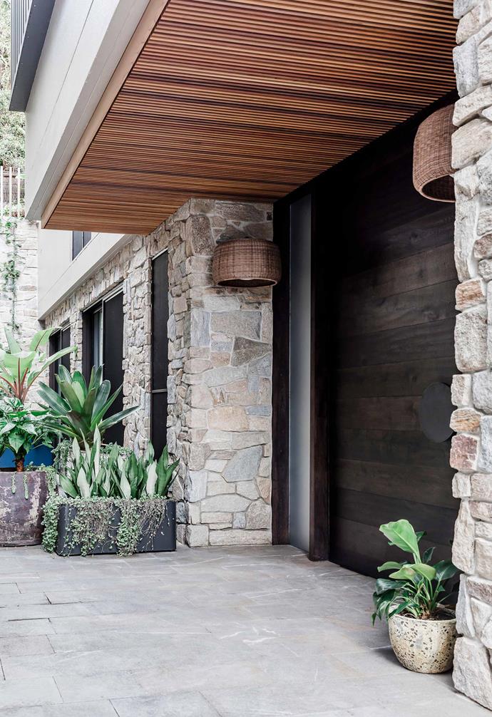 Stone cladding becomes a stunning visual feature in this home.