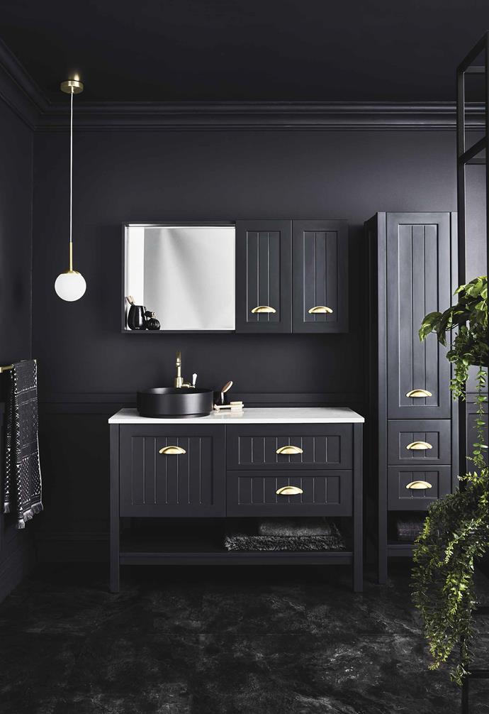 **Black is back** With a nod to traditional Shaker style, Reece's 'Kado Era' range has a vanity unit with gold-brass handles and a stone top plus shaving and linen cabinets, all in Dulux Domino. *Photography: Maree Homer*.