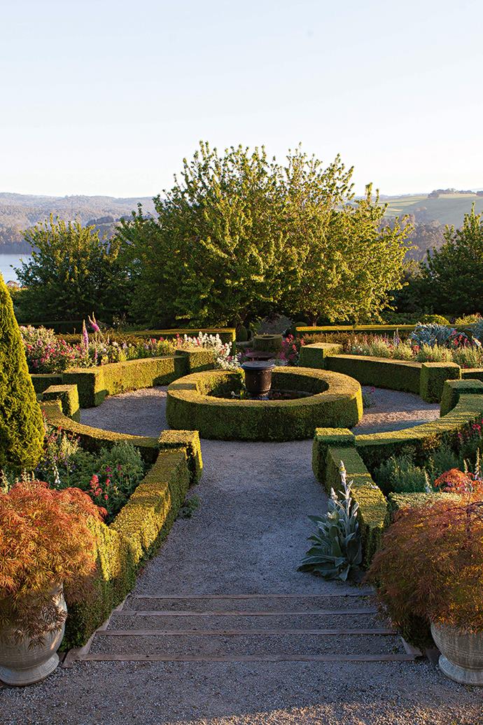 The top level of Philip Hunter and David Musker's terraced garden, just north of Jindivick in Victoria, has been densely planted with low-growing shrubs to preserve the view from the top terrace into the garden below. Plants grow extremely well in this well-watered part of Victoria, but Philip and David take no chances with maintenance. "Each year after rose pruning, we [heavily mulch the garden](https://www.homestolove.com.au/farmhouse-wrap-around-verandah-12074|target="_blank") beds using steamed wood chips and that helps to keep down the weeds," David says.