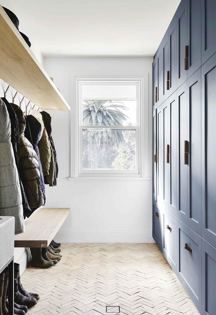 Herringbone floor tiles work in mudrooms of any size and can be a great focal point. Reclaimed brick adds texture and warmth to this otherwise minimal mudroom by Adelaide's [Enoki Design](https://www.enoki.com.au/|target="_blank"|rel="nofollow").