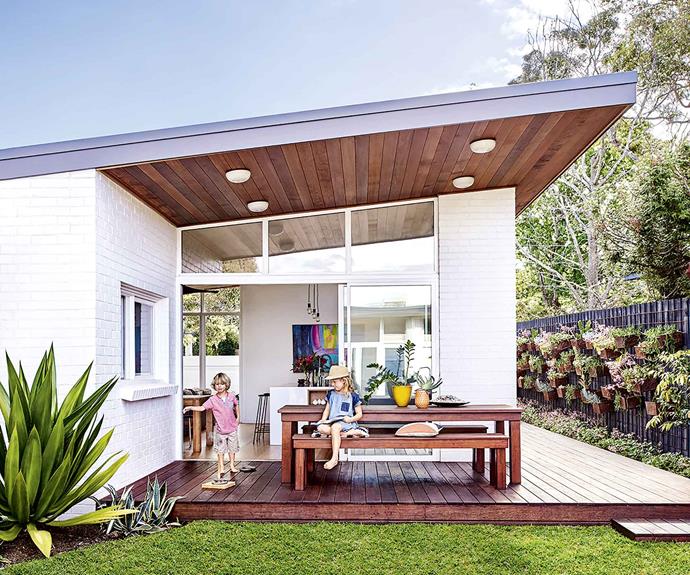 A weatherboard house was given a retro mid-century modern revamp